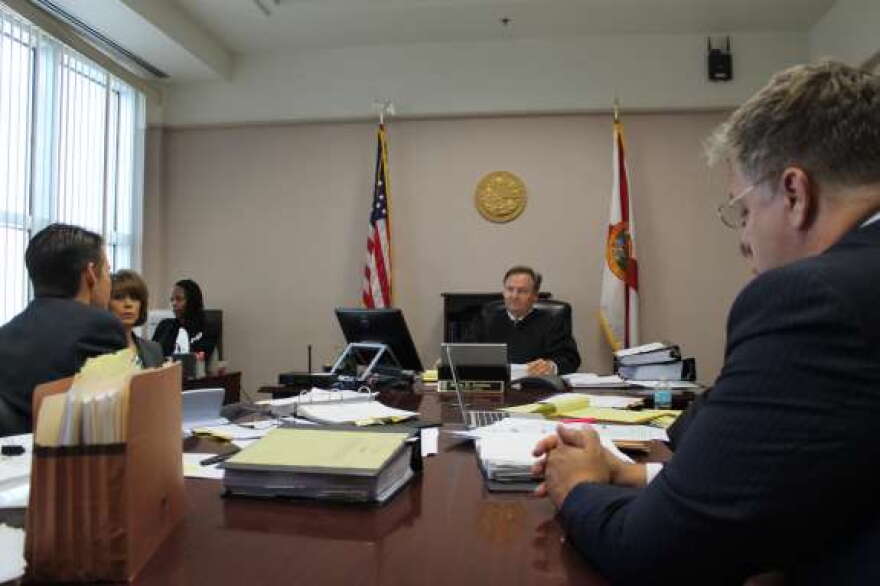 Orange County Judge John Jordan hears arguments from Disney attorney John Ward Smith (L) and Roscoe attorney Brian Denney (R). Photo: Renata Sago.