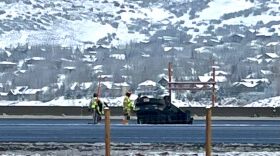 A vehicle headed east past Jeremy Ranch on Interstate 80 Tuesday morning hit a pothole and flipped over the highway median into oncoming traffic. But authorities say no one was seriously hurt.