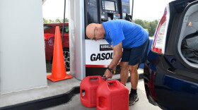 Residents fill up their gas tanks at the Costco Wholesale Gas Station ahead of Hurricane Isaias' expected landfall along the Gulf Coast, Thursday, Oct. 8, 2026, in Mobile, Ala. (AP Photo/Octavio Jones)