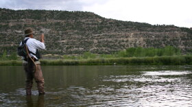 Man fishes at Navajo Lake State Park in New Mexico