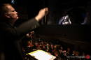 Jamie Allbritten leads the orchestra from the pit in a Piedmont Opera performance. Photograph by Traci Arney.