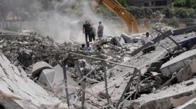 People who returned to their village following the announcement of an initial ceasefire agreement between the United States and Iran, use an excavator as they search for dead bodies under the wreckage of a destroyed house in the southern village of Touline, Lebanon, Tuesday, June 16, 2026. (Mohammed Zaatari/AP)