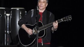 FILE - This Sept. 22, 2018 file photo shows singer-songwriter Paul Simon performing in Flushing Meadows Corona Park. (Photo by Evan Agostini/Invision/AP, File)