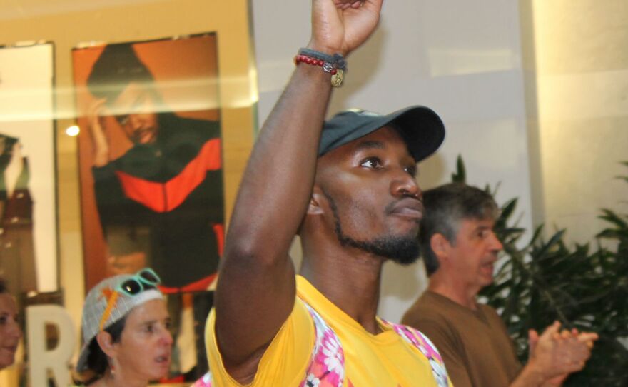 A protester at West County Center mall in Des Peres