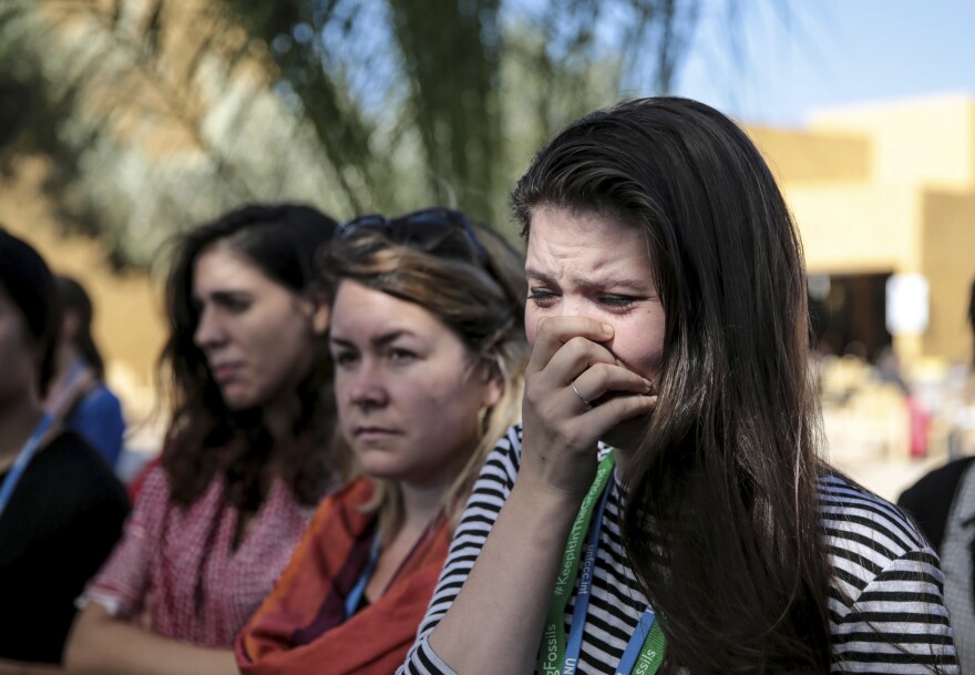Environmental activist Bethany Hindmarsh, 26, cries during a protest against President-elect Donald Trump at the Marrakech climate conference on Nov. 9.