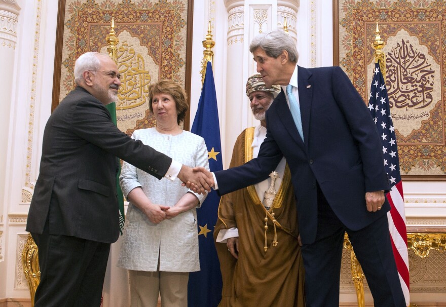 Secretary of State John Kerry (right) and Iranian Foreign Minister Javad Zarif shake hands as Omani Minister Responsible for Foreign Affairs Yussef bin Alawi and former EU top diplomat Catherine Ashton watch Nov. 9 in Muscat, Oman.