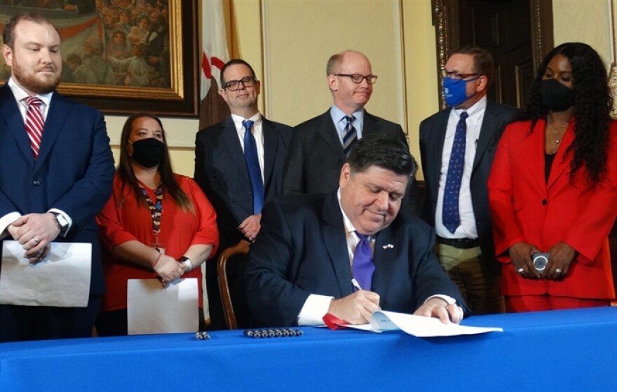 Gov. JB Pritzker signs a bill on Tuesday entitling public school, community college and public university employees who are fully vaccinated against COVID-19 to receive paid administrative leave for any days they miss this school year due to coronavirus-related issues.