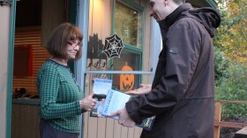 Paul Graves, Republican candidate in the 5th Legislative District, speaks with Jackie Treadwell on her porch in Maple Valley.