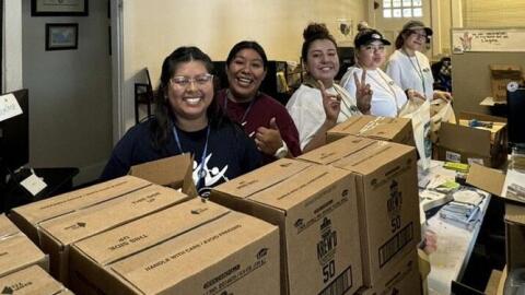 CAFÉ volunteers prepare boxes of supplies for agricultural workers, ensuring community support during extreme weather conditions. Pictured left to right, Yesenia Perez Ana Sanchez, Angelica Garcia-Macias, Joanna Sanchez, and Stephanie Guzman. (Credit: CAFÉ)