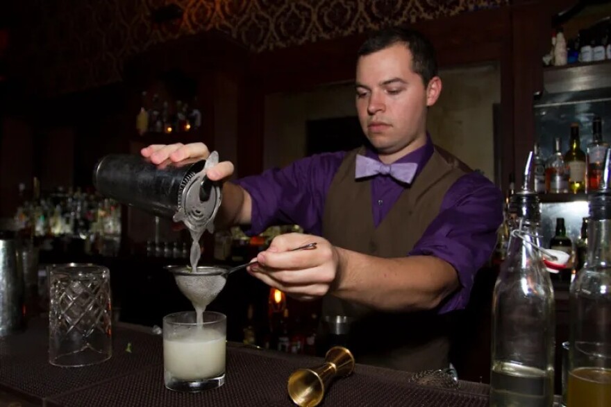 In this file photo from 2013, Stephan Mendez is seen crafting a “Texecutioner” cocktail.