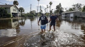 People walking through water