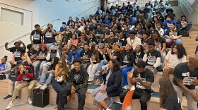 Rising hip-hop star La Reezy poses with students at New Orleans Charter Science and Mathematics High School on May 1, 2026