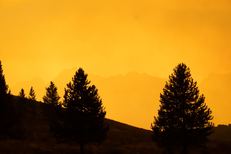 An orange sky descended on Stanley on Wednesday, Aug. 28, 2024, as the Wapiti Fire burns west of town.