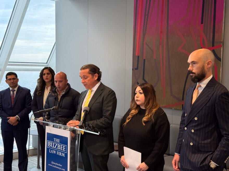 Tony Buzbee speaks at a press conference in Houston flanked by Brianna Aguilera's mother, right, and father, left. Dec. 5, 2025. 