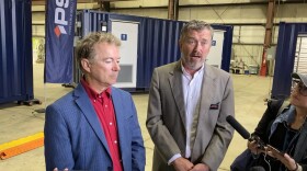 Republican U.S. Sen. Rand Paul (left) and Congressman Thomas Massie (right) spoke to reporters at the first of six stops on Wednesday, Sept. 24, at Portable Solutions Group in Wurtland, Kentucky.