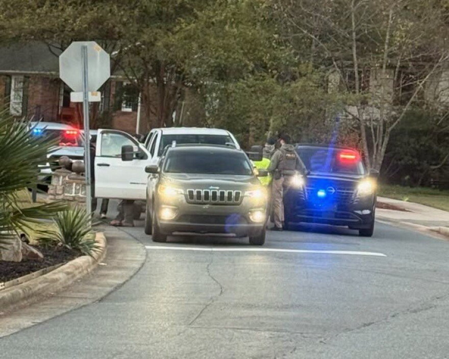 Cop cars behind pickup truck at traffic stop