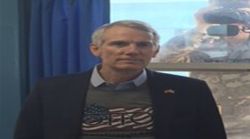 Senator Rob Portman wore his Otto Warmbier t-shirt while a North Korean guard takes a picture during a recent trip to the DMZ.