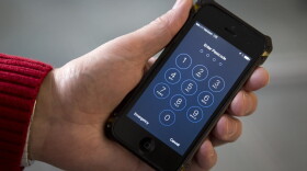 In this Feb. 17, 2016, file photo an iPhone is seen in Washington. A new lawsuit claims the governments practice of searching laptops and cellphones at airports and border crossings is unconstitutional because modern electronic devices carry troves of private information.  (AP Photo/Carolyn Kaster, File)