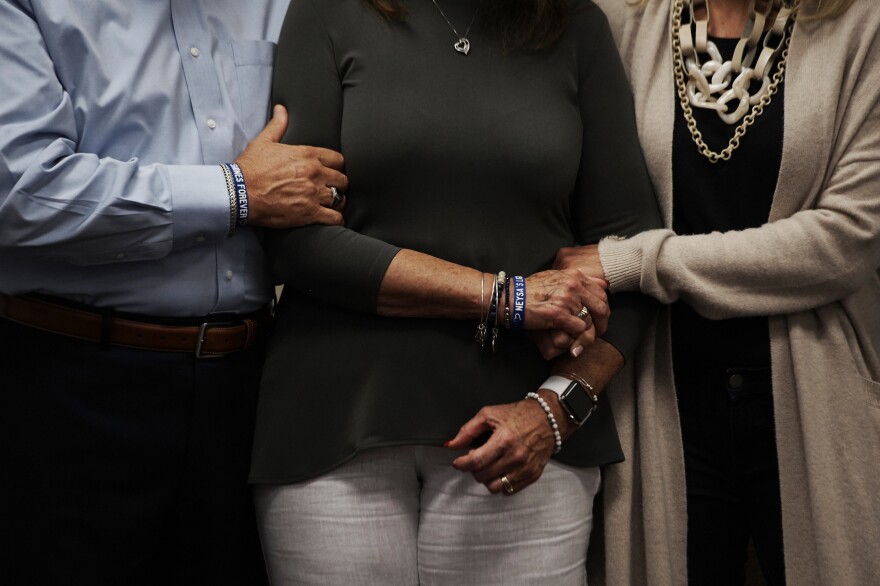 Neysa Tonks' parents, Chris and Debbie Davis, and sister, Mynda Smith, embrace during a news conference for Children of the 58 on Sept. 14, 2018,<strong> </strong>at the College of Southern Nevada in Las Vegas. Tonks was a single mother of three sons.