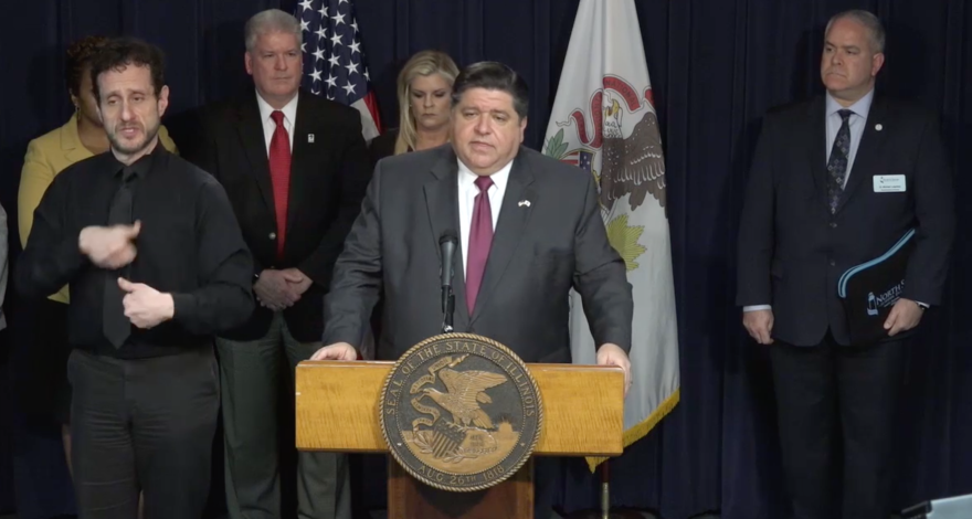 Gov. J.B. Pritzker speaking with reporters at the James R. Thompson Center in Chicago