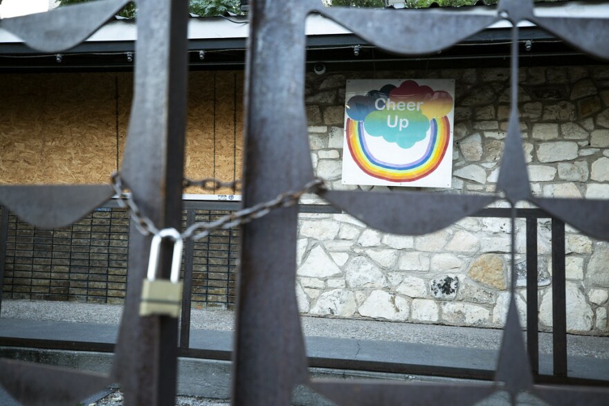 A padlock on the gate outside Cheer Up Charlie's, which closed when the pandemic hit. 