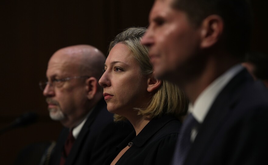 (From left) Sam Liles, acting director of Homeland Security's Office of Intelligence and Analysis Cyber Division, Jeanette Mafra, acting director of DHS' national protection and programs directorate, and Bill Priestap, assistant director of the FBI's Counterintelligence Division, testify during a hearing before the Senate Intelligence Committee on Wednesday.