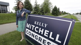 Indiana State Treasurer Kelly Mitchell stands by a campaign sign, Thursday, May 28, 2020, in Westfield, Ind. Mitchell is a candidate for Indiana's 5th Congressional District. More Republican women than ever are seeking House seats this year after the 2018 election further diminished their limited ranks in Congress. But so far it appears that any gains this November could be modest.