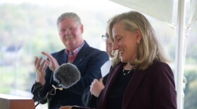 From left, Virginia Delegate Tony Wilt and Secretary of Transportation Nick Donohue look on as Gov. Abigail Spanberger takes the podium outside Rocktown High School to announce the start of an Interstate 81 widening project in Harrisonburg. This will add a third lane in both directions between mile markers 242 and 248.