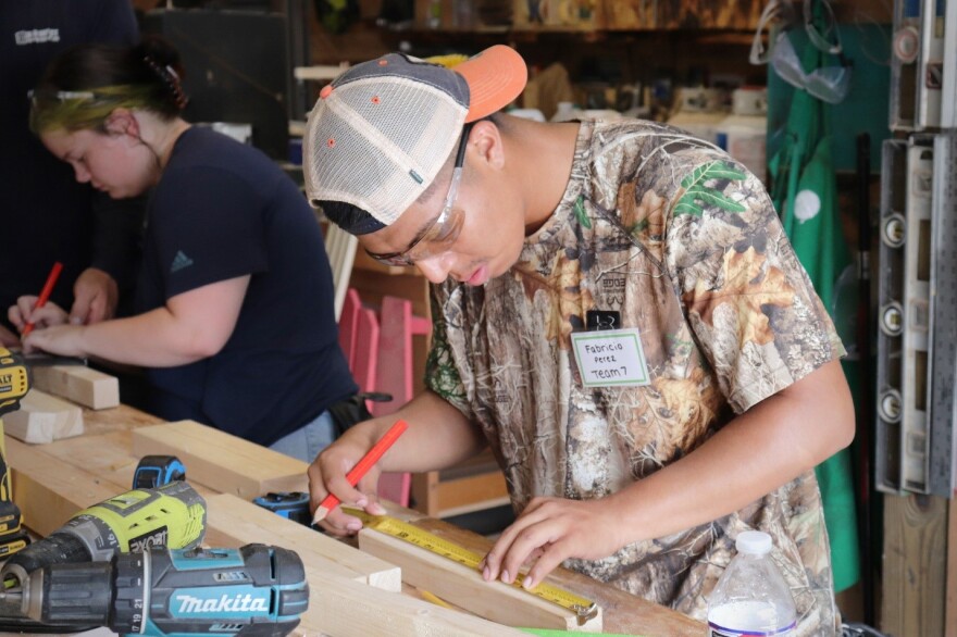 Fabricio Perez and Kyli Carroll learn carpentry skills at the 2023 Ready-to-Work Skilled Trades, Marine & Manufacturing Boot Camp.