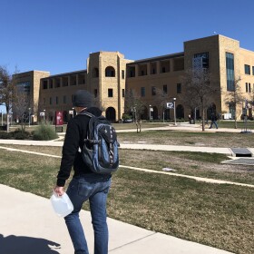  A student walks across the Texas A&M University-San Antonio campus in February 2020.
