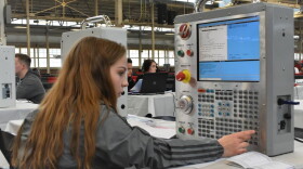 A career and technical education student in Indiana programs a machine at a statewide SkillsUSA competition.