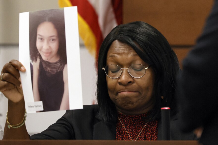 Anne Ramsay holds a picture of her daughter, Helena, before giving her victim impact statement during the penalty phase of the trial of Marjory Stoneman Douglas High School shooter. (Amy Beth Bennett/South Florida Sun Sentinel via AP, Pool)