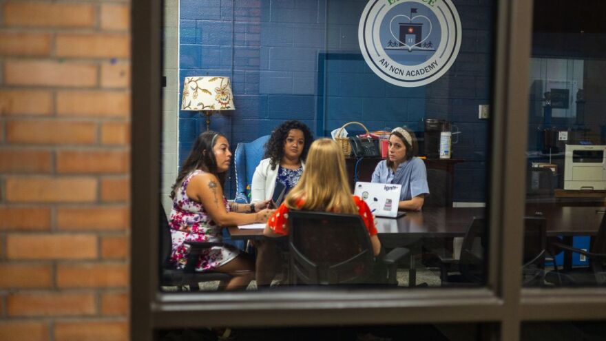 Enlace Academy leaders and educators hold a meeting at the school on Wednesday, Aug. 20, 2025, l-r: Stephanie Campos, school leader; Tylie Mendoza-Robertson, K-5 assistant leader; Katherine Dulay, executive director; and and teacher Megan Singh.
