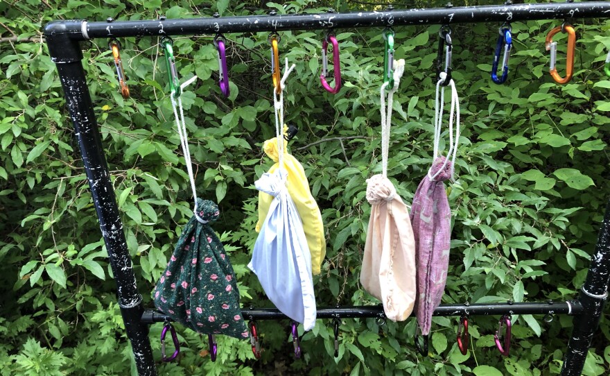 Birds that have been caught in nets sit in bags before they are studied at the Silvio O. Conte National Fish and Wildlife Refuge in Hadley, Massachusetts, on July 22, 2022.