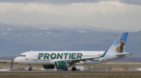 FILE - A Frontier Airlines jetliner taxis to a runway to take off from Denver International Airport Thursday, April 23, 2020, in Denver.