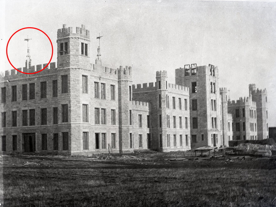 As one of Altgeld Hall’s original 11 stone grotesques, “Olive Goyle” was once perched on the parapets above the building’s west entrance. Here she is in 1897, when Northern Illinois State Normal School was still under construction.