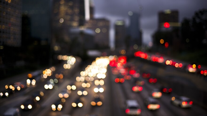 Traffic moves along the 110 Freeway in downtown Los Angeles on Wednesday. Wednesday and Thursday will be the season's busiest traffic day in the United States, according to AAA forecasts.