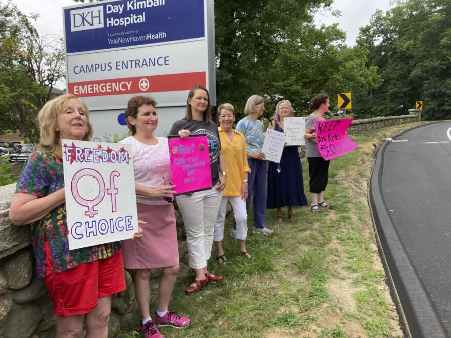 Residents from various communities in mostly rural northeastern Connecticut stage a protest outside Day Kimball Hospital, Monday, July 18, 2022 in Putnam, Conn. The protesters are concerned with Day Kimball Healthcare's plans to affiliate with Covenant Healthcare, a Catholic health system that abides by directives set by the U.S. Conference of Catholic Bishops.