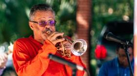 Longineu Parsons playing the trumpet during a live performance.