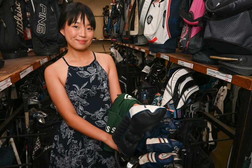  Anh-Dao Do shows where she collected her golfer's bag for the day while caddying at Indian Hills Country Club.
