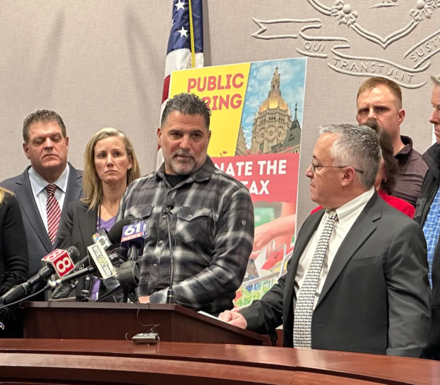 Dave Palumbo, the Democratic town chair of North Branford, speaks at a GOP press conference with House Minority Leader Vincent J. Candelora. Palumbo owns a trucking company that pays the new mileage tax.