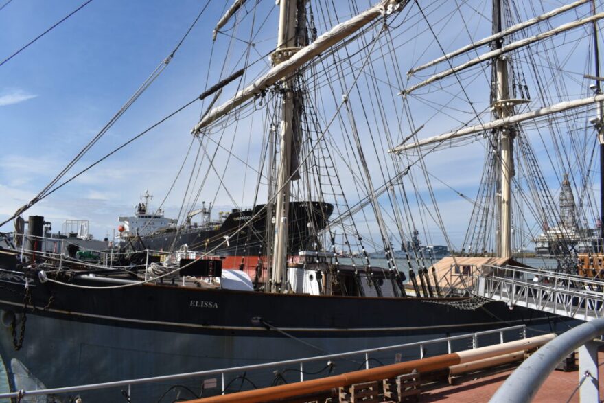 Pictured is the 1877 tall ship Elissa, a square-rigged iron barque served as a cargo vessel over one hundred years ago.