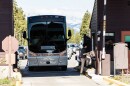 A tour bus entering Yellowstone Park from the West Yellowstone entrance.