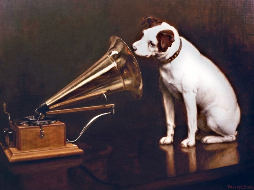 In England, artist Francis Barraud (1856-1924) painted his brother's dog Nipper listening to the horn of an early phonograph during the winter of 1898. Victor Talking Machine Company began using the symbol in their trademark, His Masters Voice, in 1900.
