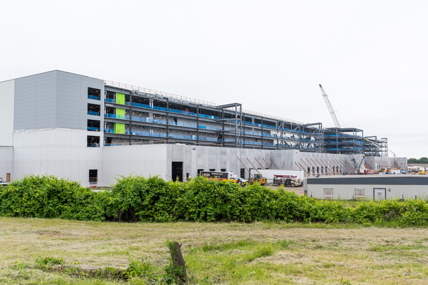 FILE: View of an Amazon warehouse building under construction in Windsor, CT on June 3, 2021. In the month prior, a total of eight nooses were discovered at the construction site.