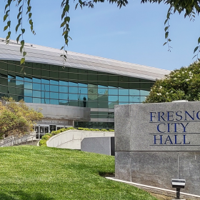 A stone sign outside Fresno City Hall identifies the building.