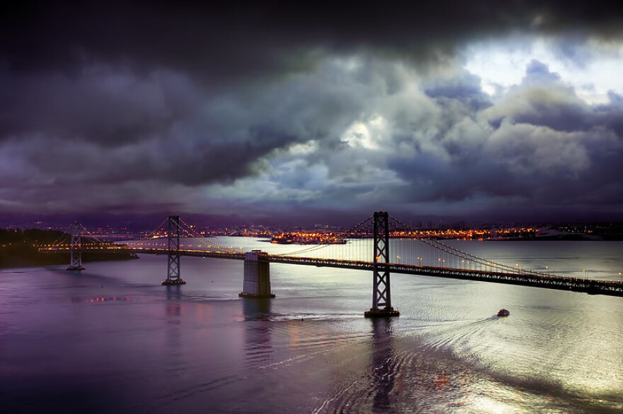 A panoramic view of a rainswept Bay Bridge