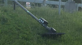 A Flock camera that’s been knocked down
