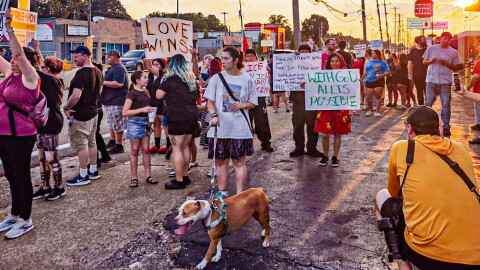 Demonstrators line Summer Avenue on Sunday to protest the El Corralon raid.