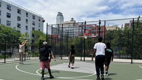 High school students play a pick-up game across the street from the Berry Street Houses, where Jose Alvarado grew up in Williamsburg, Kings County.